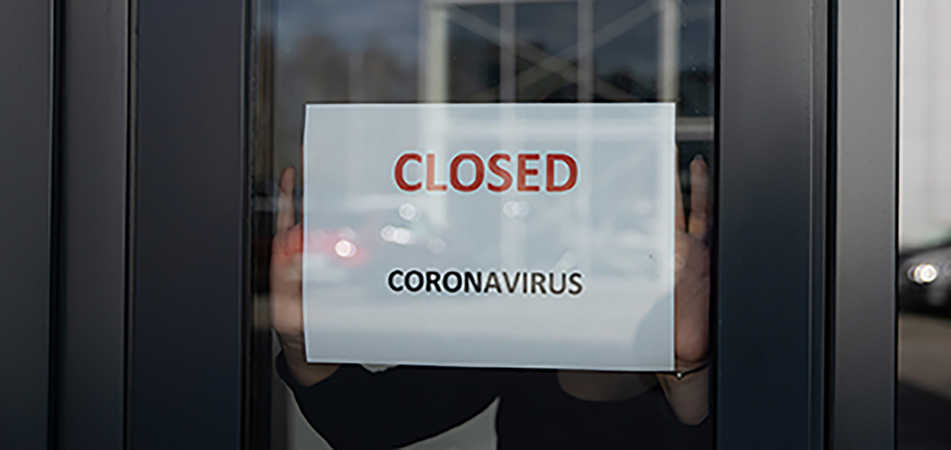 Closed because of corona. Sign in window. Closed shop.